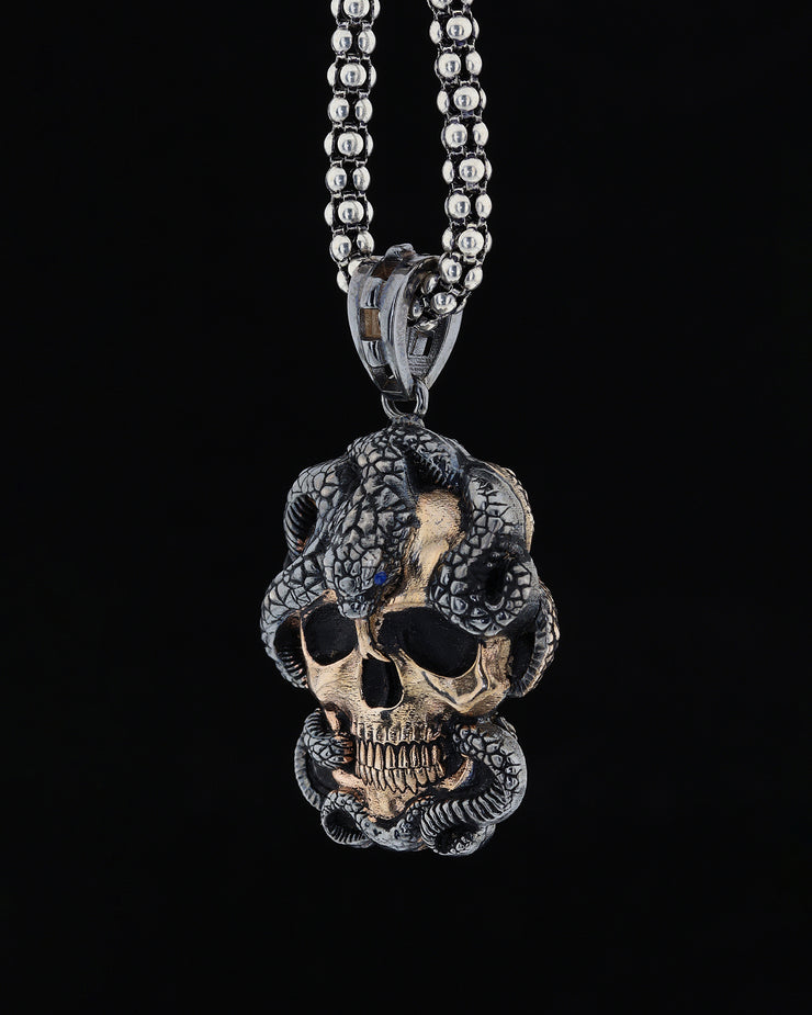 Skull and snake figure necklace